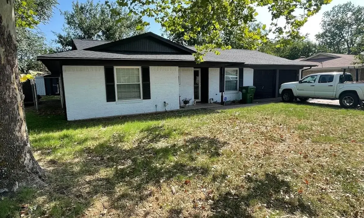 Professional roofing crew working on a residential roof in Newfane